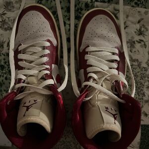 red embroidered women’s nike jordans with some wear and creasing